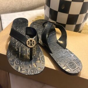 Tory Burch black Flip Flops with Gold Logo